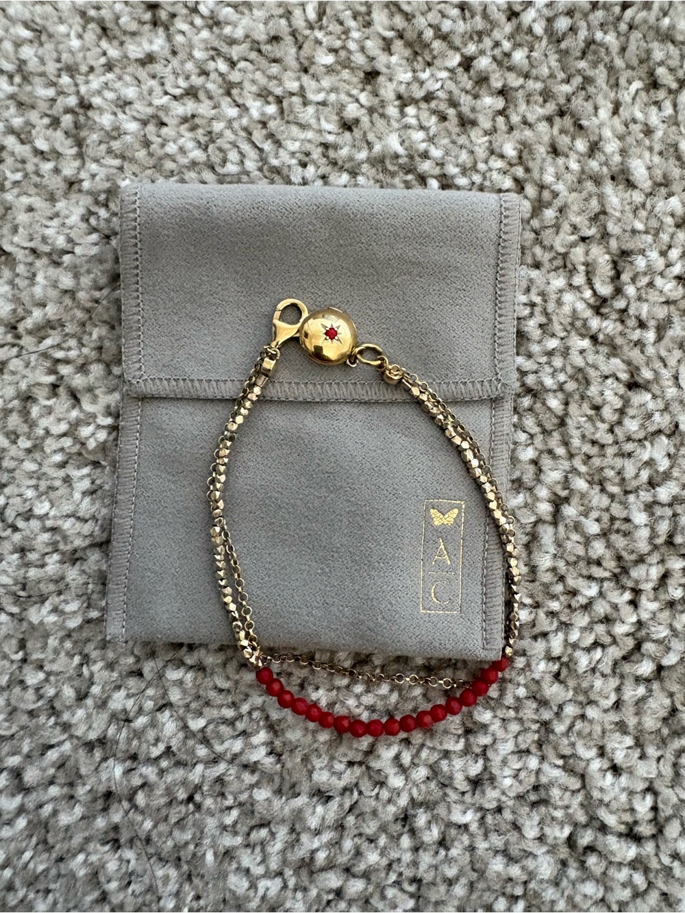 Gold-Tone Bracelet with Red Beads and Locket Charm